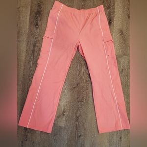 Scrubs pants pink with white stripe. Size Large